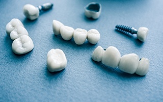 Different types of dental implants in Rockwall on blue background