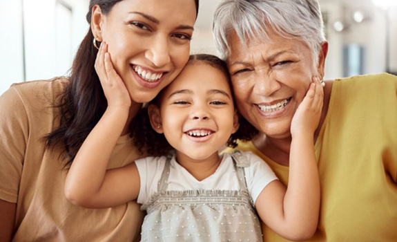Three generations of family smiling together