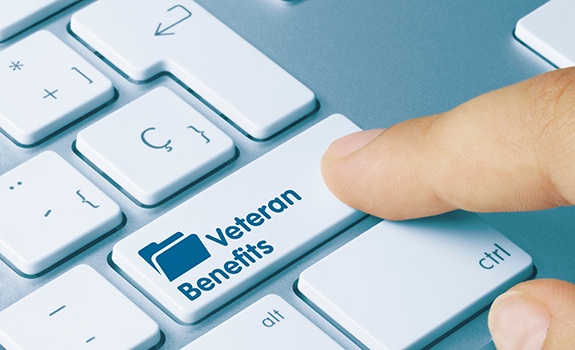 Key on computer keyboard labeled Veteran Benefits