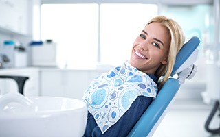 Smiling woman sitting in dental office