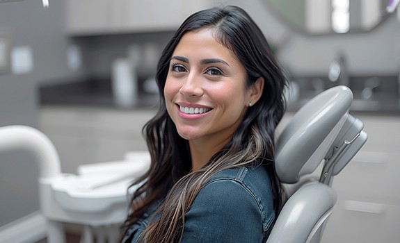 Smiling patient in dental treatment chair